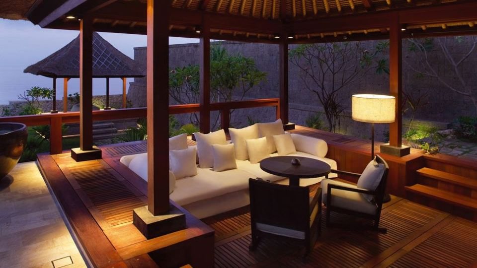 Open lounge pavilion with timber roof at dusk