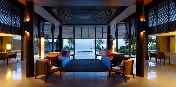 Interior of a guest suite with timber screens and ocean view