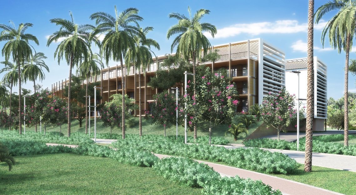 Render of low-rise condominium buildings among palms