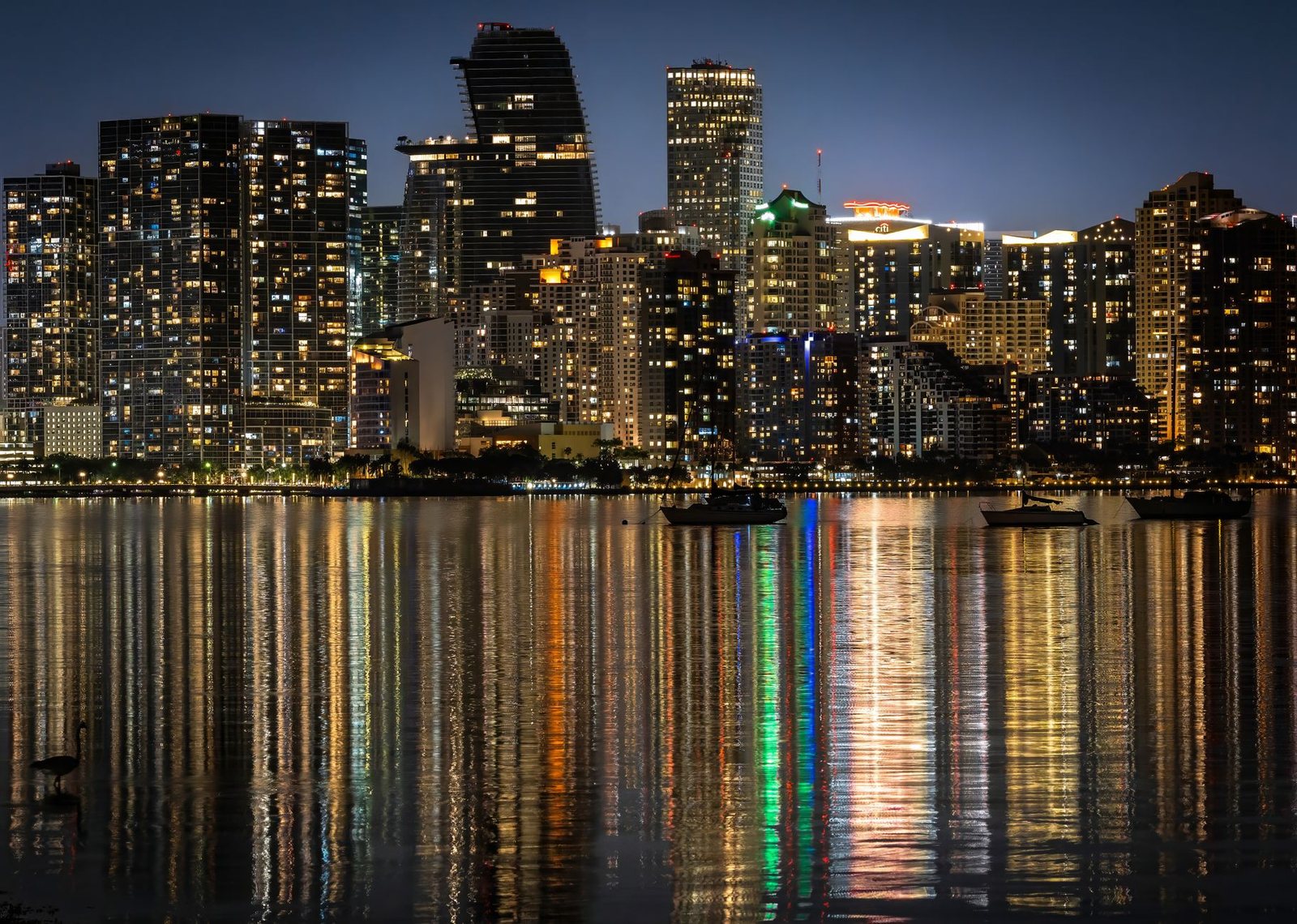 The Miami skyline at night, seen across Biscayne Bay